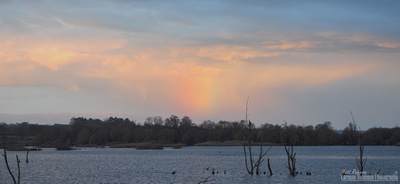 Incoming rain storm and rainbow